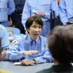 Japanese PM Takaichi visits quake-hit southern region as cleanup begins in intense heat