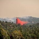 Fire in southwestern Spain active as 470 moved to safety