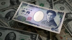 Dollar gains on rate hike expectations, yen retreats past 160