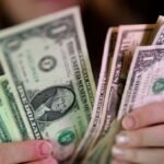Dollar rises to 2-week high, Middle East conflict and rate paths in focus
