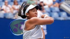 Osaka holds her nerve to reach US Open third round