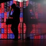 Shares skid in Asia as oil rises, rate hikes loom