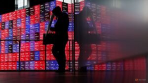 Shares skid in Asia as oil rises, rate hikes loom