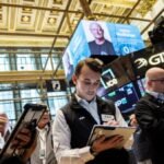 Nasdaq sets record high on AI optimism, oil drops below $100