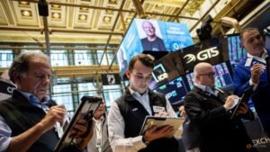 Nasdaq sets record high, oil dips on improved crude flows