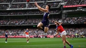 Australian Rules-Brisbane hold off Fremantle in thriller to win third straight AFL Grand Final