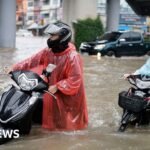 Bangkok roads submerged as flood disaster declared