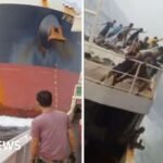 Dramatic moment a cargo ship crashes into another vessel