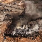 Syria arms depot explosion kills at least 14