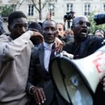 French mayor caught in tear gas while shielding student protesters from police