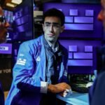 Treasury yields inch lower as investors pare back Fed rate hike bets