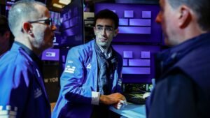 Treasury yields inch lower as investors pare back Fed rate hike bets
