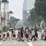 ‘Full house every day’: F1 crowds shrug off haze as businesses see little impact on demand
