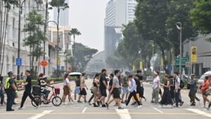 ‘Full house every day’: F1 crowds shrug off haze as businesses see little impact on demand