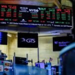 Nasdaq hits record as dollar and Treasury yields climb, oil prices ease