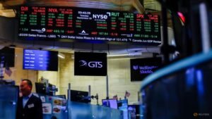 Nasdaq hits record as dollar and Treasury yields climb, oil prices ease