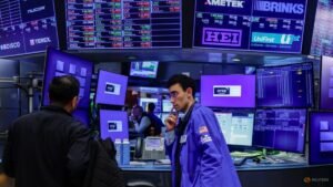 Stocks slip as dollar heads for weekly loss