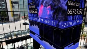 Shares slide again as oil stays high; AI earnings in focus