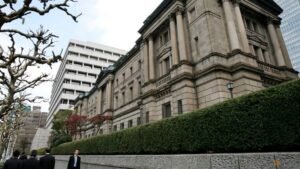 Bank of Japan may raise inflation forecast, stand pat on rates, sources say