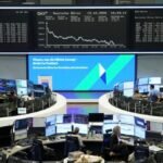 Shares down again as oil stays high; AI earnings in focus