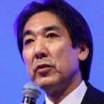 Japan is not yet officially out of deflation, economy minister says