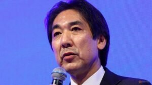 Japan is not yet officially out of deflation, economy minister says