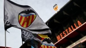 Soccer club Valencia says group backed by KKR founders buys 42% stake