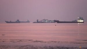 Iran says four tankers on fire after hitting mines in Strait of Hormuz