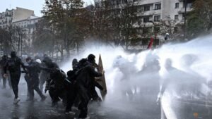 Clashes break out as hundreds of thousands protest in France