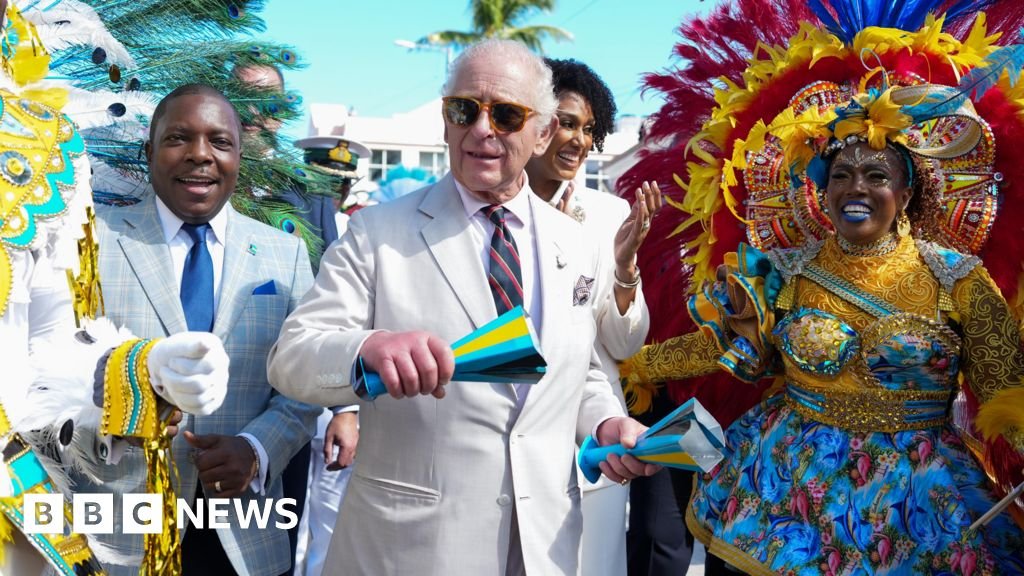 King dances in the streets of the Bahamas capital