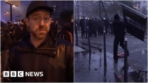 Fireworks and tear gas as protesters and riot police clash in Paris