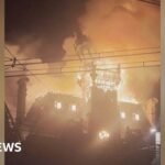 Watch: Moment historic French town hall spire collapses in flames amid protests