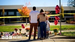 Oregon teacher fought school attacker before armed dad killed suspect