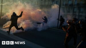 Clashes erupt between police and protesters in Paris