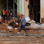 Flooding in southeastern Spain has killed a 102-year-old woman and trapped some 90 people