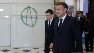 Macron vows ‘strong measures’ to combat protests that rocked France
