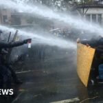 Clashes erupt in Paris after largely peaceful protests across France