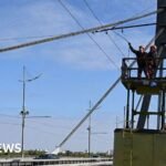 Kyiv bridge hit in further drone attack as German chancellor makes surprise visit