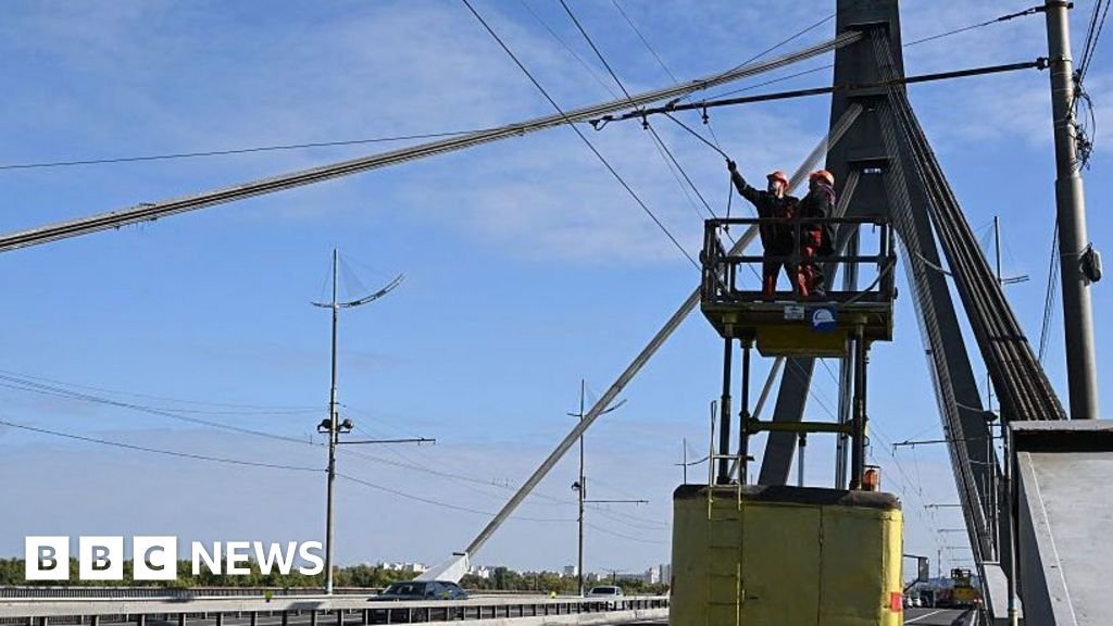 Kyiv bridge hit in further drone attack as German chancellor makes surprise visit